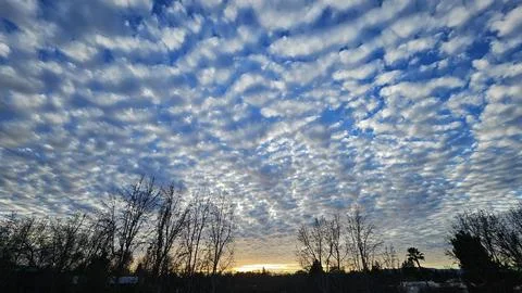 Beautiful cloud patterns formed in a summer afternoon Stock Photos