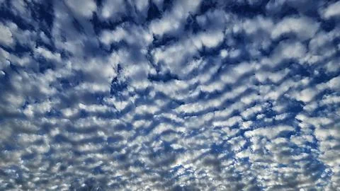 Beautiful cloud patterns formed in a summer afternoon Stock Photos