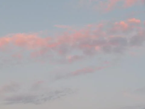 Beautiful cloud with the reflection of the sun forming colors Stock Photos
