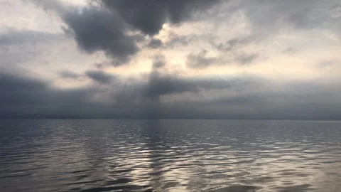 Beautiful cloud reflections on a calm sea during voyage at sunset. Seascape.. 스톡 동영상 280083381