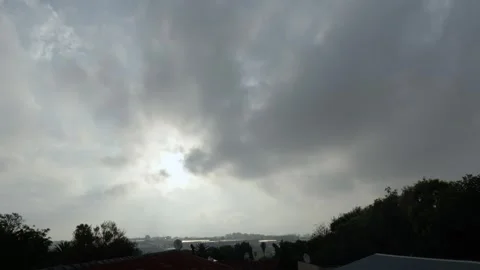 A beautiful Cloud time lapse of fluffy clouds moving over an Urban area Stock Footage 253431123