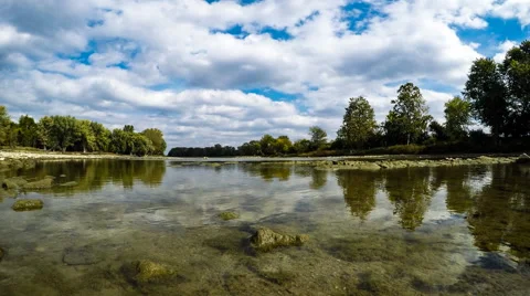 Beautiful cloud time lapse reflecting in calm clear water Video stock 68651890