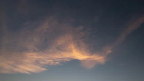 Beautiful cloud transformation backlit by sunset sun Stock-Footage 154716395