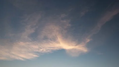 Beautiful cloud transformation backlit by sunset sun Видео 155068468