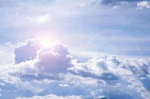 Beautiful cloud view with shining sun on blue sky. Nature concept Stock Photos