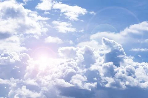 Beautiful cloud view with shining sun on blue sky with customizable space f.. Stock Photos