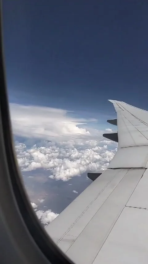 Beautiful clouds from an airplane window Stock Footage 299019565