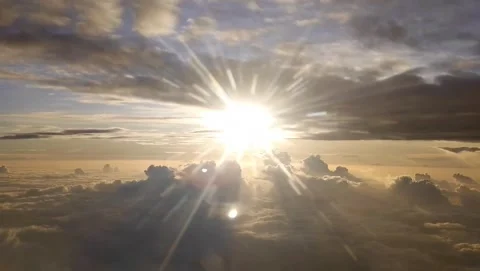 Beautiful Clouds and Sun captured from an airplane Stock Footage 134276778