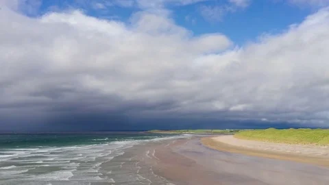 Beautiful clouds and waves on seashore at beach Stock Footage 79824702