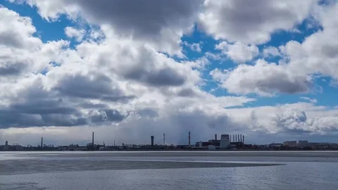 Beautiful clouds in the blue sky above the city. Stock Footage 124160378