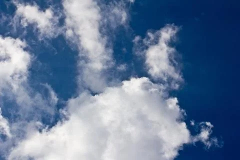 Beautiful clouds in the blue sky as the background Stock Photos