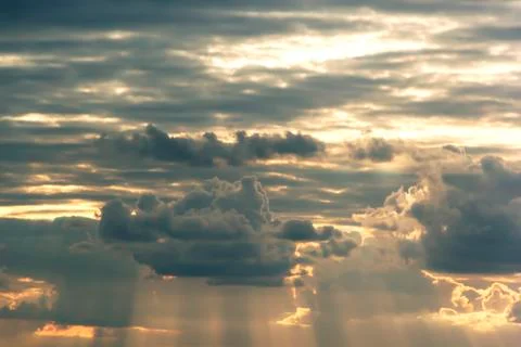 Beautiful clouds in the evening setting sun Stock Photos