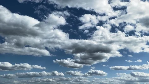 Beautiful clouds float across the blue sky. Stock Footage 194452581