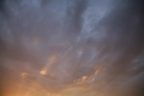 Beautiful clouds float across the blue sky. Stock Photos