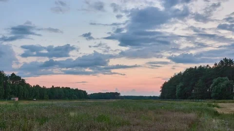 Beautiful clouds float in evening sky. Picturesque summer nature. Stock Footage 208860509