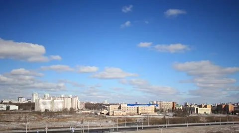 Beautiful clouds float in the sky rapidly over the city Stock Footage 48266483