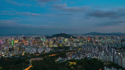 Beautiful clouds flow through Seoul city skyline aerial view  night Stock Footage 162604365