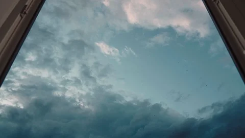 Beautiful clouds fly fast outside the window Stock Footage 129810446