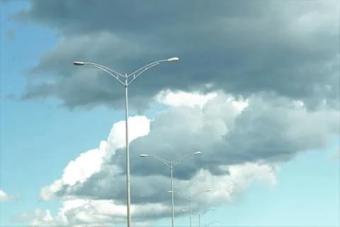 Beautiful clouds with light in foreground, may be used as background Stock Photos