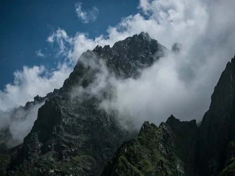Beautiful clouds in mountains timelapse 5k Stock Footage 71678974