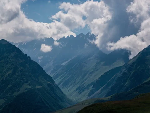 Beautiful clouds in mountains timelapse Stock Footage 71681137