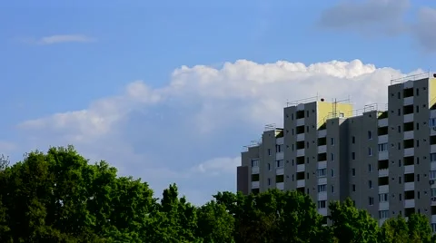 Beautiful clouds move behind modern high rise building Stock Footage 50033905
