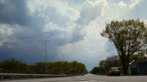  Beautiful clouds move over a long highway Stock Footage 129615933
