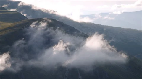 Beautiful clouds moving in the mountain hills Stock Footage 40499720