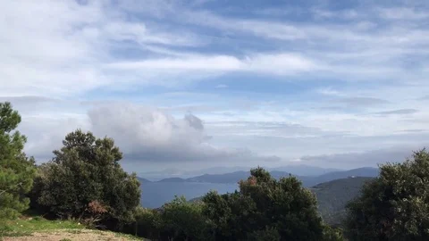 Beautiful clouds moving over the hill on a a green island 스톡 동영상 82939896