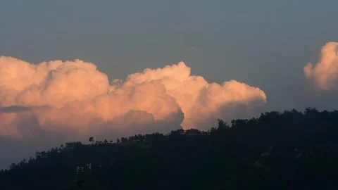 Beautiful clouds moving over a mountain Stock Footage 273494374