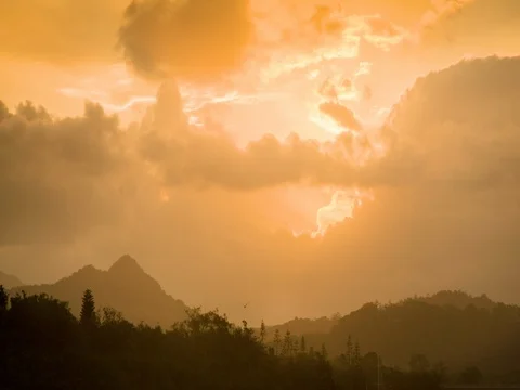 Beautiful clouds moving over mountains at dusk Stock Footage 76198449