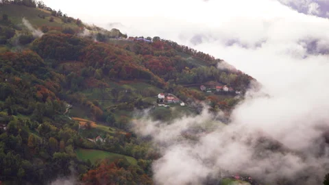 The beautiful clouds over the forests and village. Hill mountains in Serbia. Stock Footage 256163815