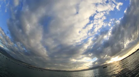 Beautiful clouds over horizon time lapse Stock Footage 34299306