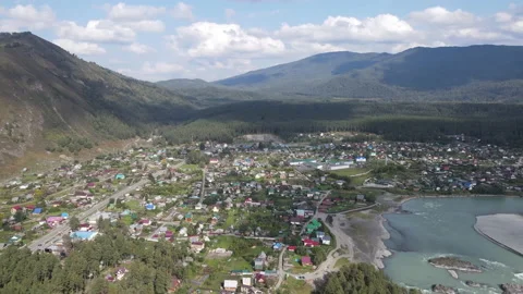 Beautiful clouds over mountains and village of Altay Video stock 161729549