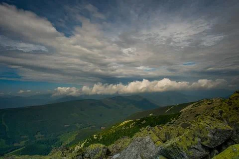 Beautiful clouds over the mountains Stock Photos
