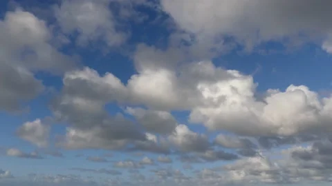 Beautiful clouds over the ocean with blue sky - background - time lapse Stock Footage 143599074