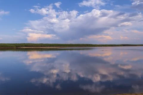Beautiful clouds over the river Stock Photos