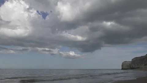 Beautiful clouds over the waterfront by the sea. Stock Footage 75712694
