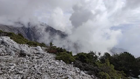 Beautiful clouds passing over a mountain area Stock Footage 169883759