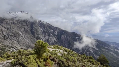 Beautiful clouds passing over a mountain area Video stock 169883819