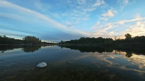Beautiful clouds reflected in the river Stock Footage 317700542
