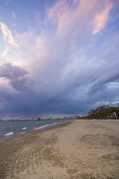 Beautiful clouds with the setting sun over the sea Stock Photos