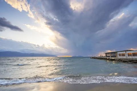 Beautiful clouds with the setting sun over the sea Stock Photos