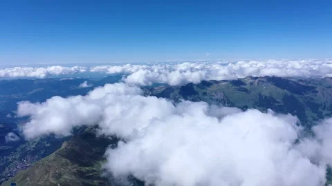 Beautiful Clouds shot from the Alps with view of valley Stock Footage 247796393
