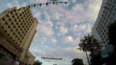 Beautiful clouds in the sky in the city, the view from the car to the city Stock Footage 160908963