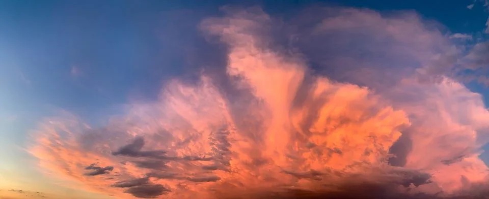 Beautiful clouds in the sky at sunset dramatic landscape Stock Photos