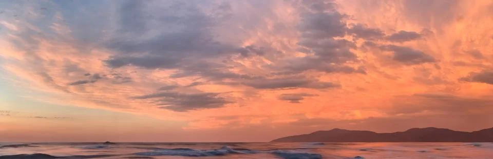 Beautiful clouds in the sky at sunset dramatic landscape Stock Photos