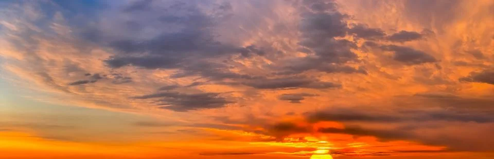 Beautiful clouds in the sky at sunset dramatic landscape Stock Photos