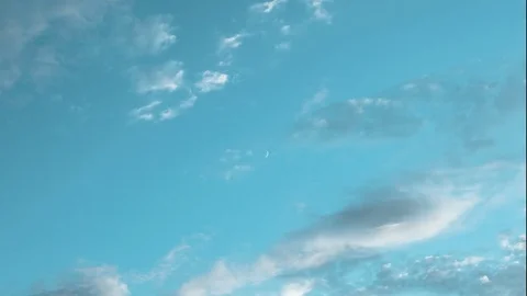 Beautiful clouds at sunset, the movement of clouds through the new moon time Stock Footage 77075383