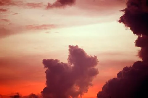 Beautiful clouds on sunset sky Stock Photos